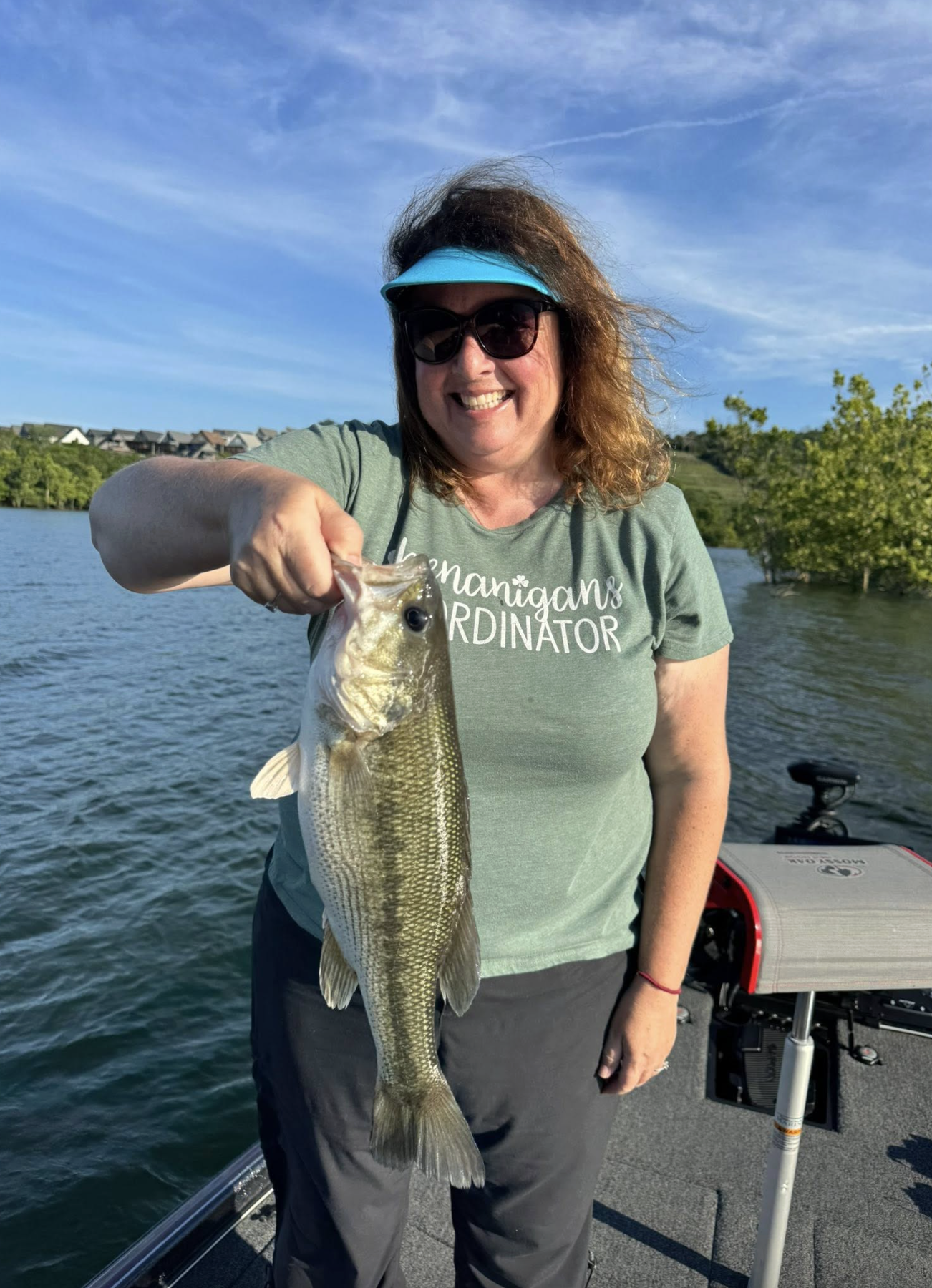 Happy angler with a largemouth bass