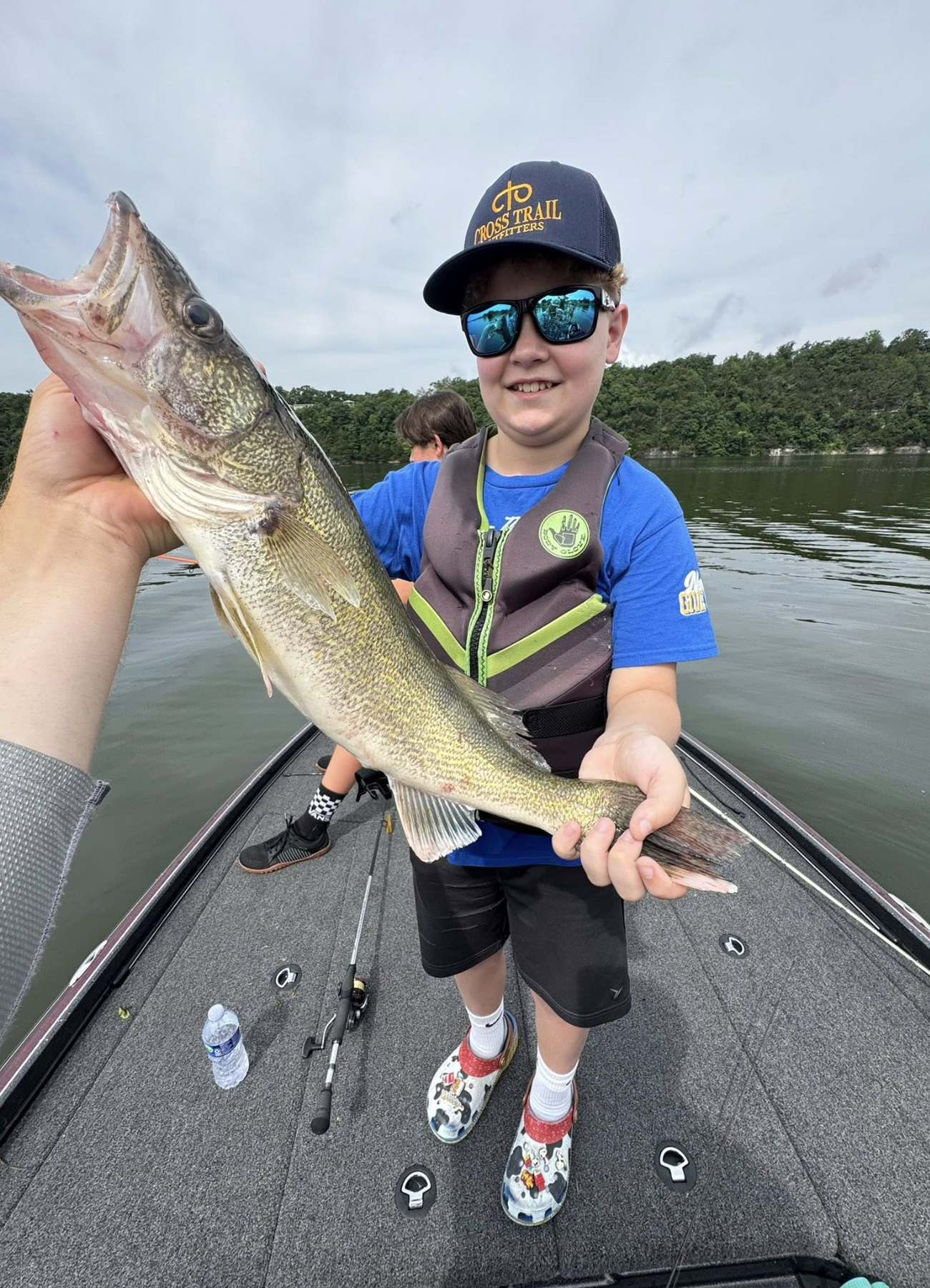Kid angler with a walleye on Table Rock Lake