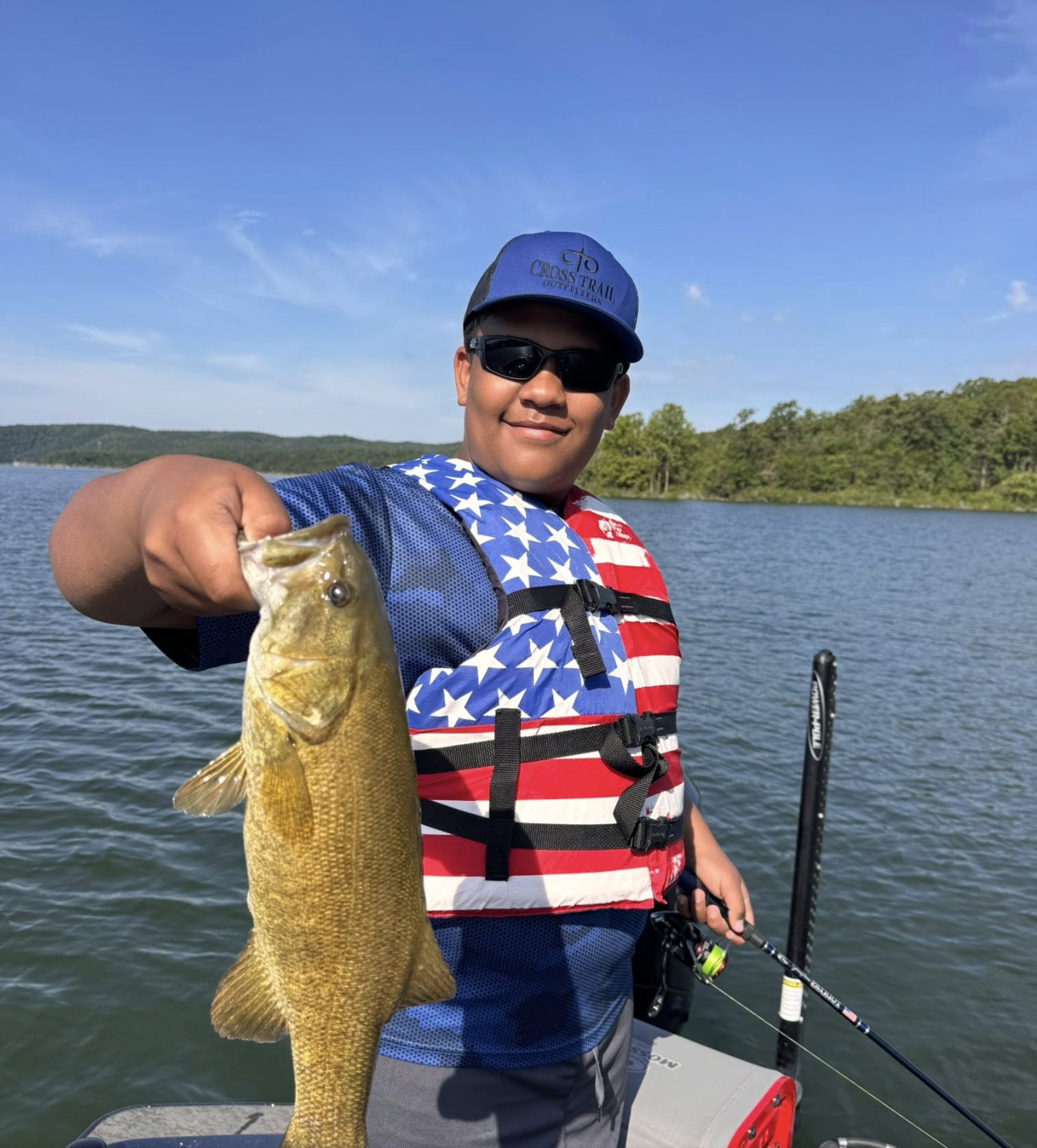 Young boy with a smallmouth bass on Table Rock Lake