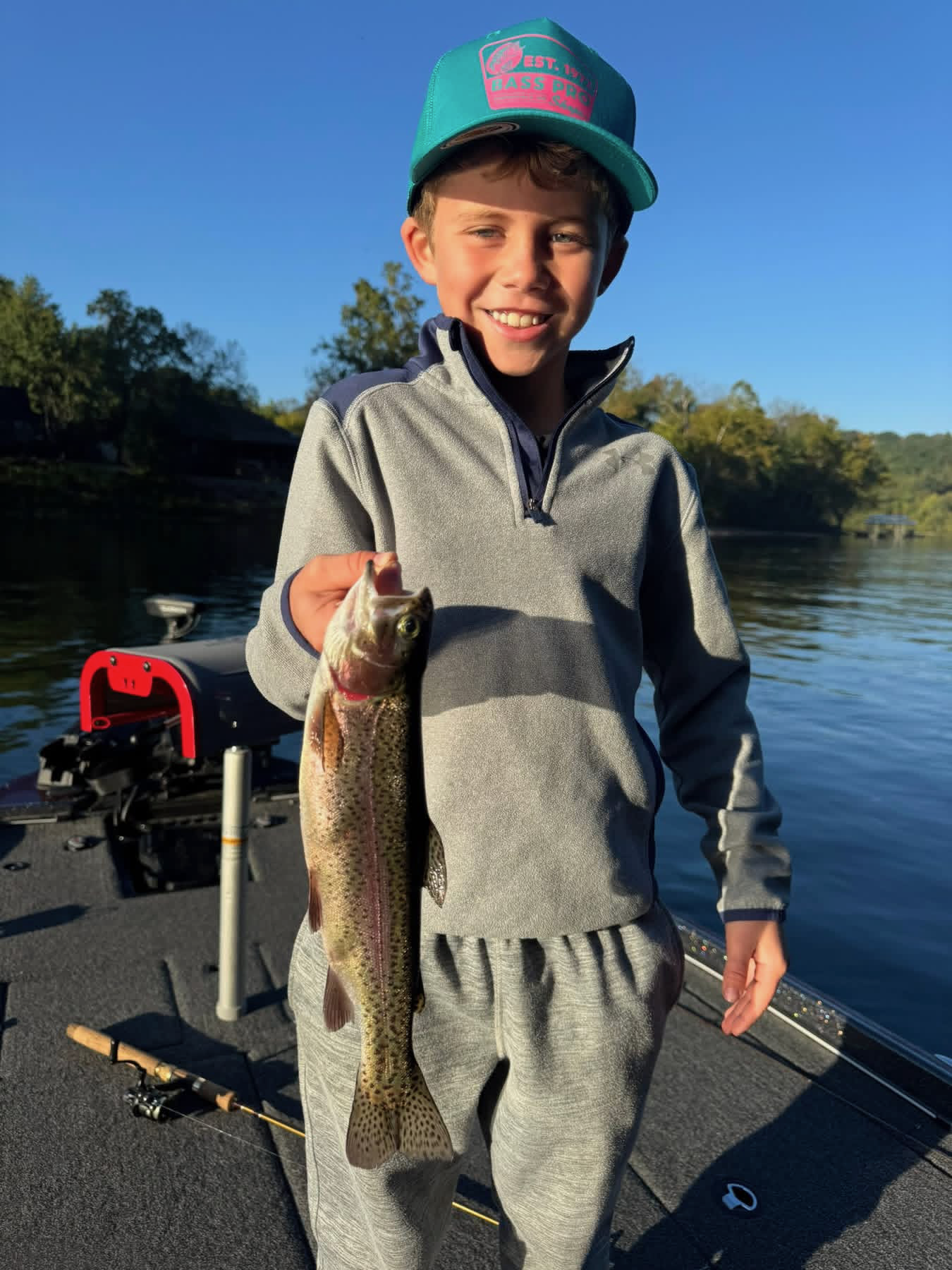 Young angler with a rainbow trout on Lake Taneycomo