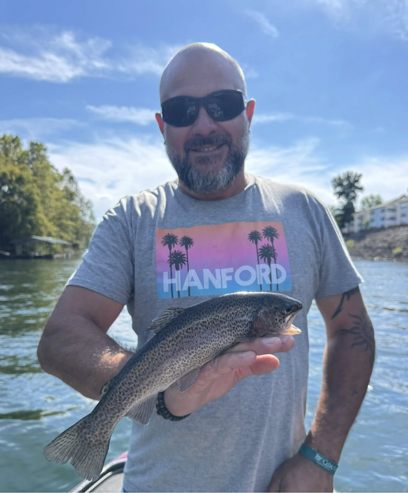 Angler with a rainbow trout on Lake Taneycomo