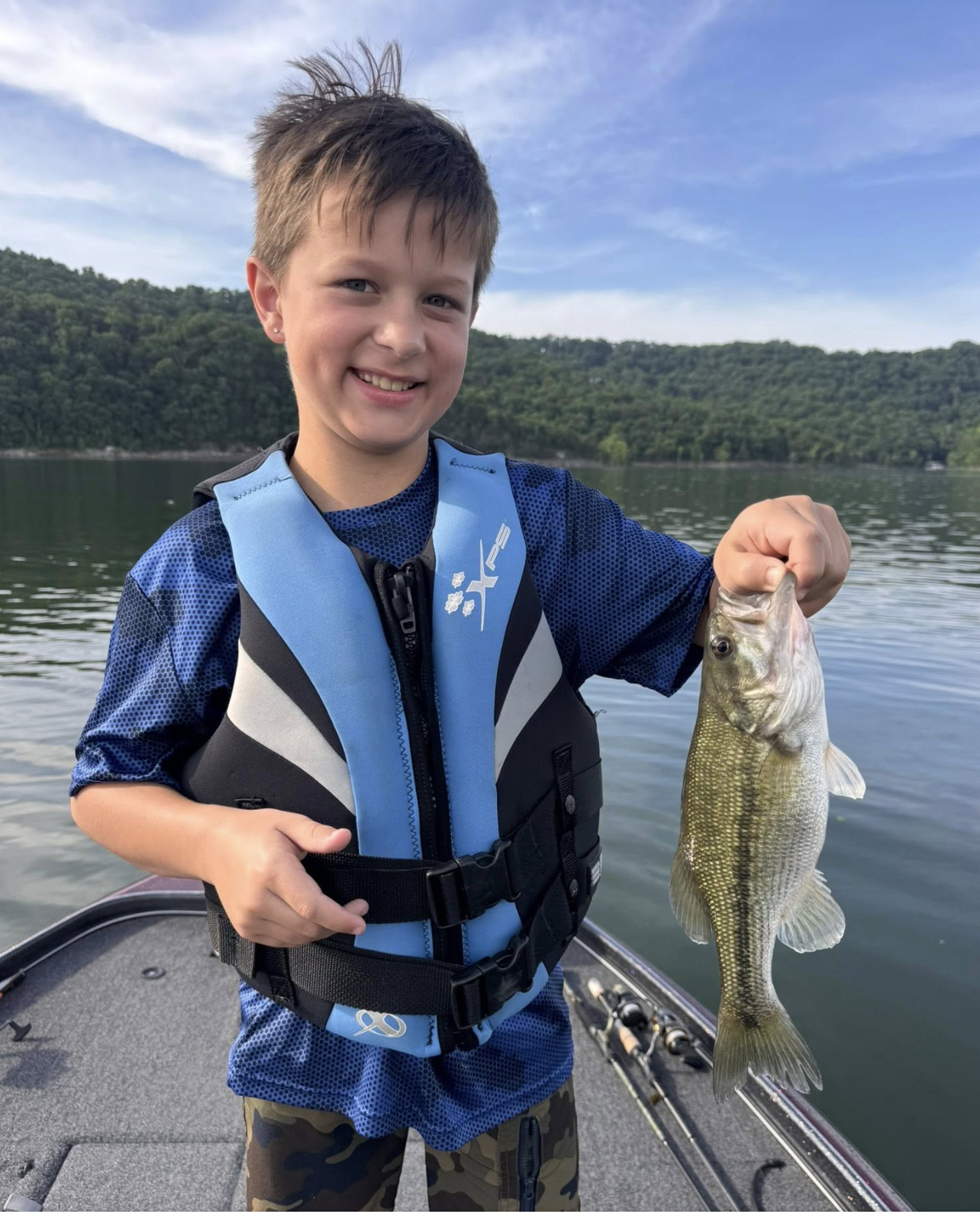 Young kid with a bass on Table Rock Lake