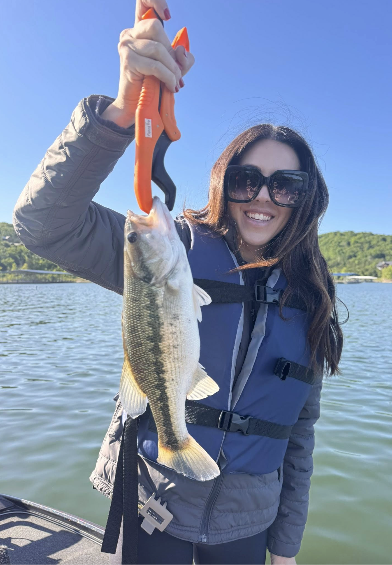 Angler holding a largemouth bass on Table Rock Lake