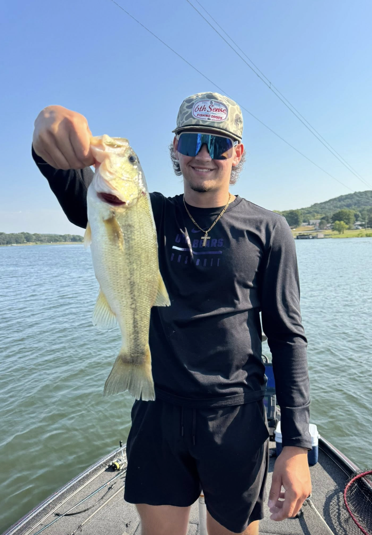 Teen angler with a nice largemouth bass