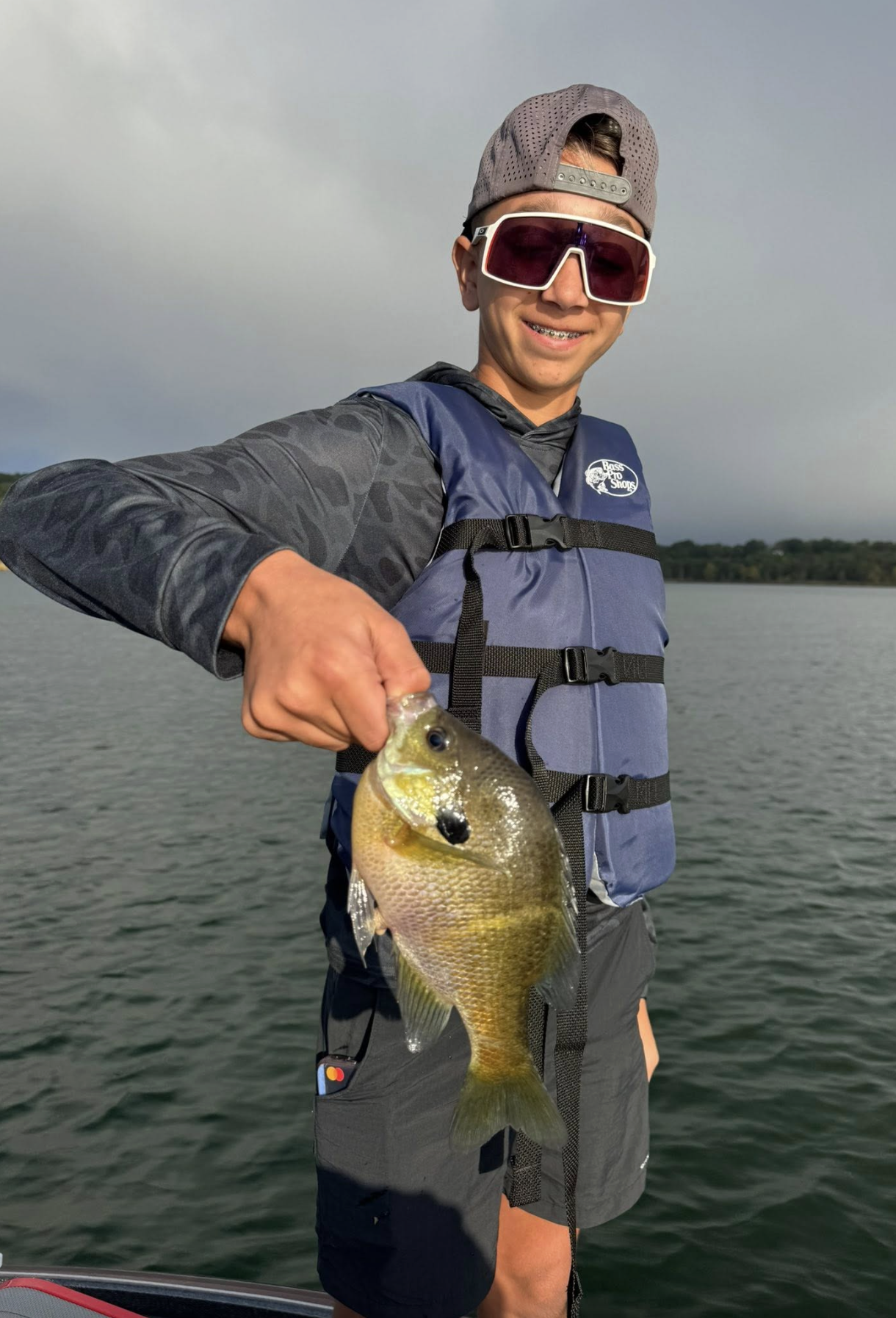 Teen angler with a bluegill — panfish trip